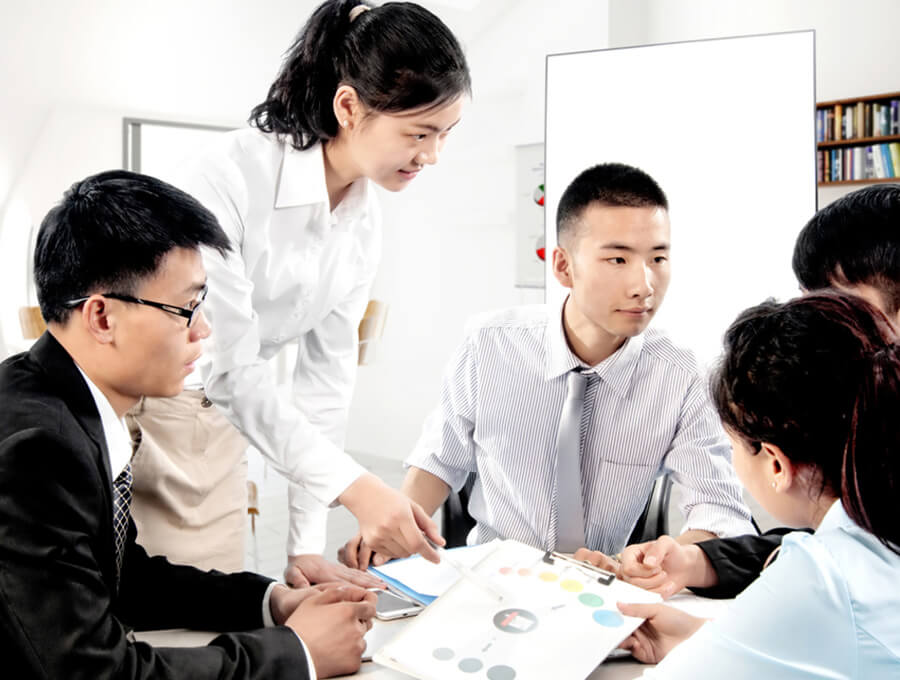 TreadClean's staff discussing custom cleanroom supplies service